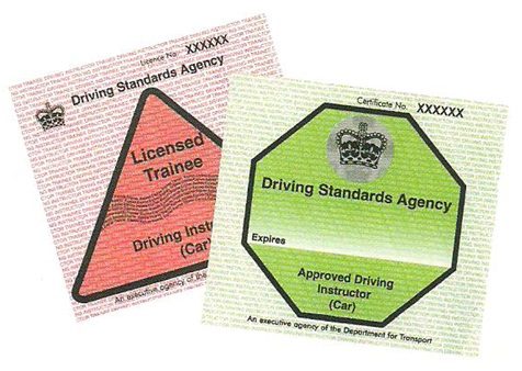 a pink PDI and a green ADI badge issued to driving instructors from the dvsa