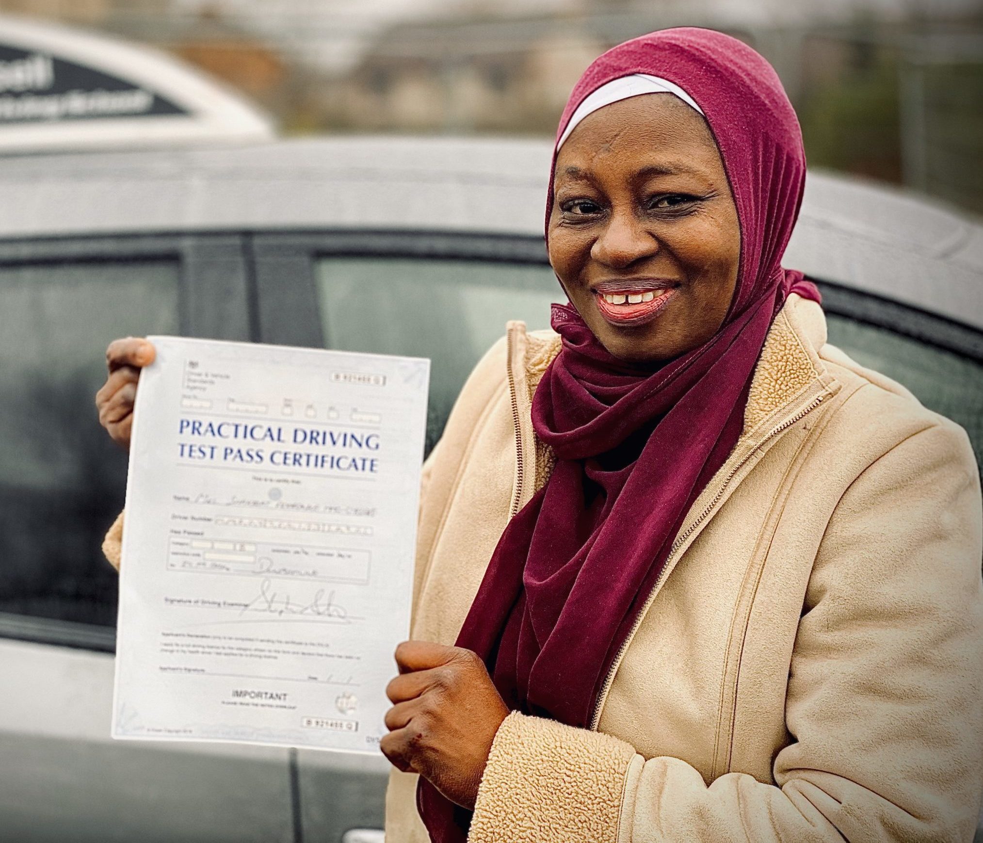 Happy driver just passed driving test after taking driving lessons with Your Pass Driving School